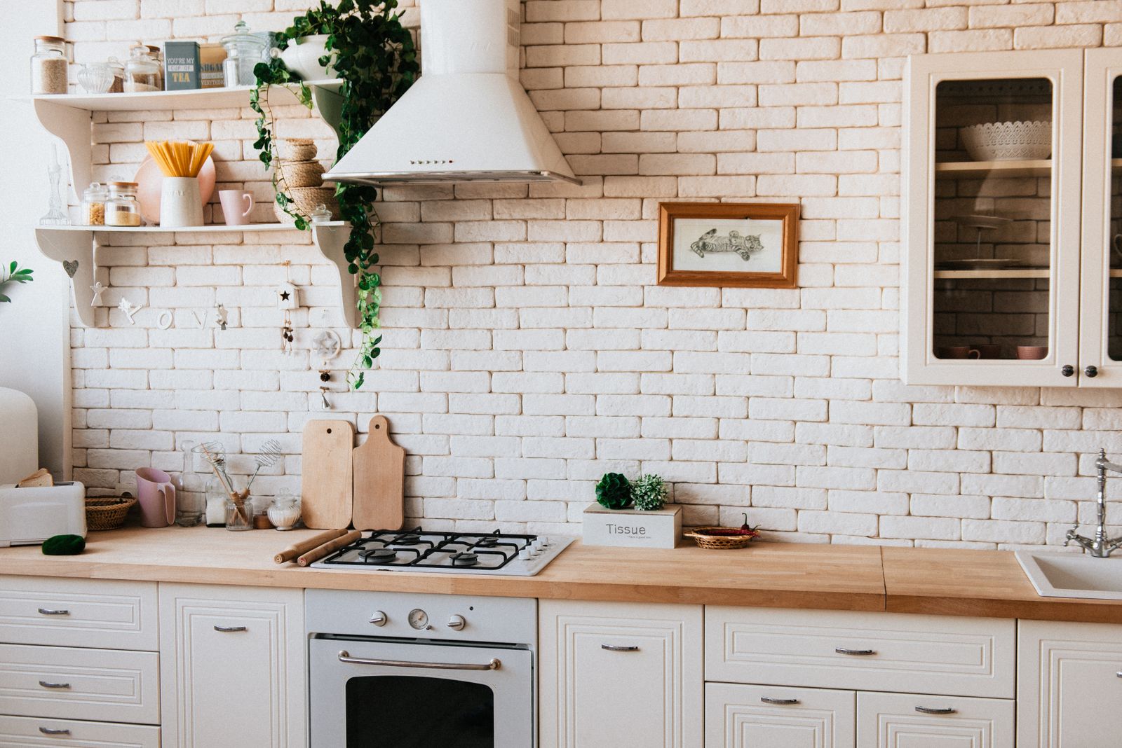 Scandinavian kitchen with brick backsplash