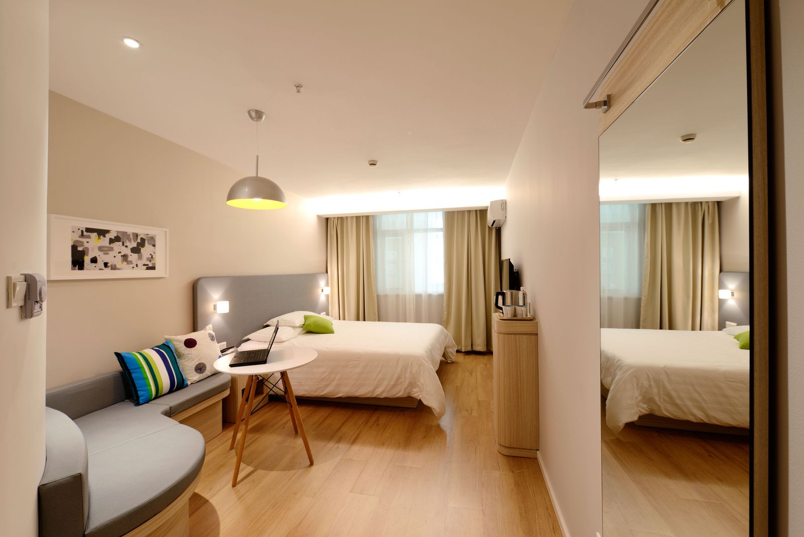 Hotel room with mirrored wardrobe