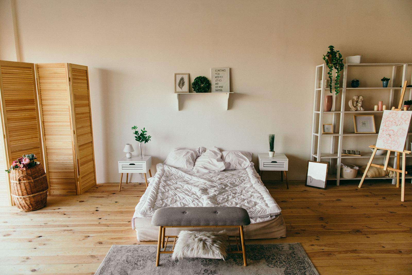 Bedroom with wooden screen and open storage